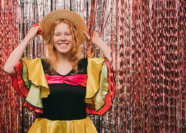 Free photo low angle woman disguised for carnival party