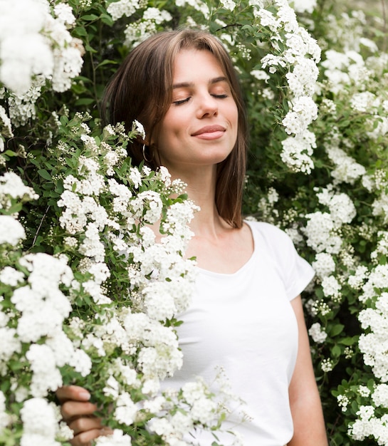 Low angle woman in flowers