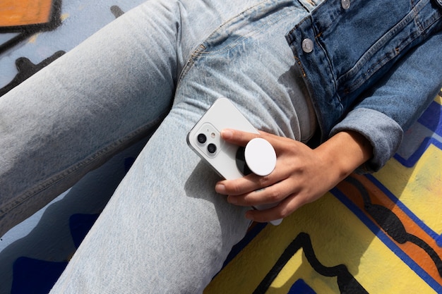 low angle woman holding smartphone