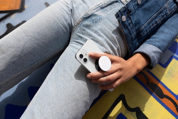 low angle woman holding smartphone