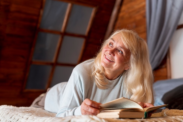 Low angle woman at home reading