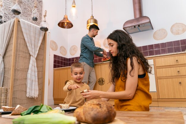 Low angle woman and kid sitting at table