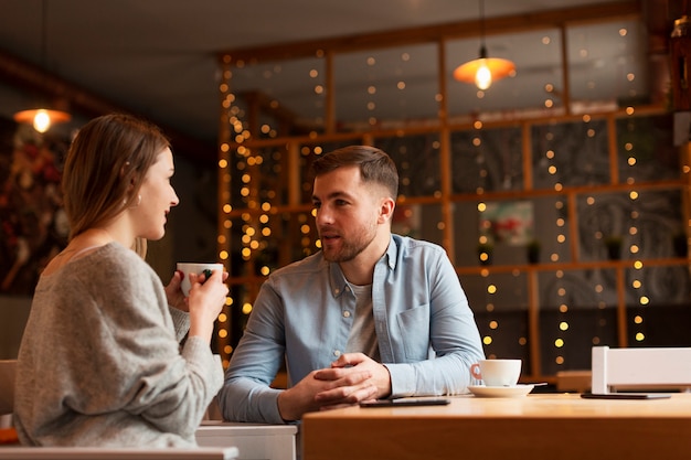 Low angle woman and male at restaurant