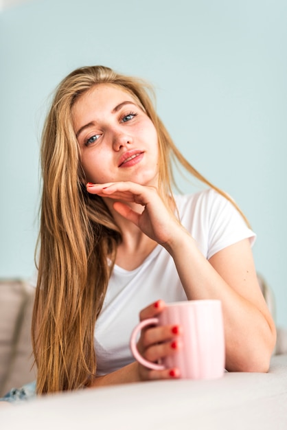 Low angle woman in pajama looking at cameras