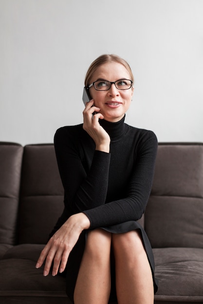 Low angle woman talking over phone