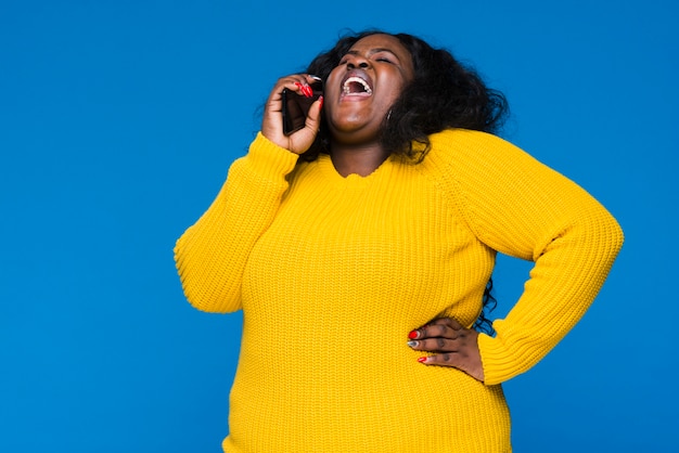 Low angle woman talking over phone