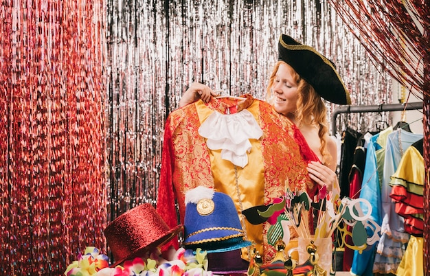 Low angle woman trying on costumes