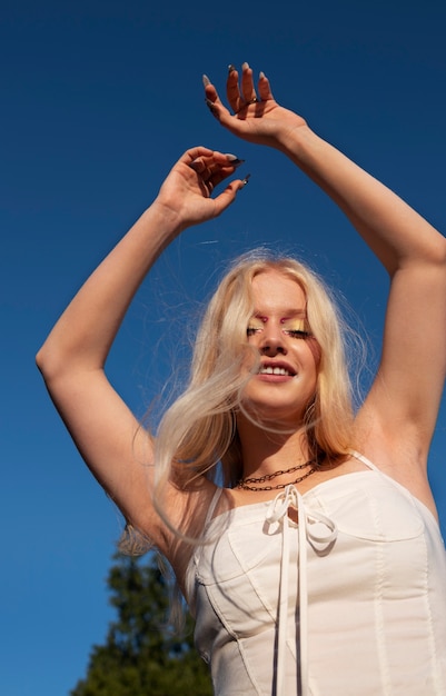 Low angle woman with  graphic eye makeup