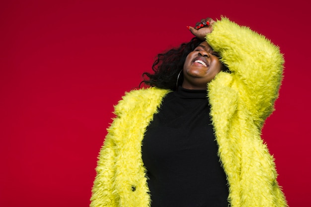 Low angle woman with yellow jacket