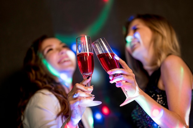 Low angle women having a drink