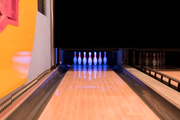 Low view bowling alley with wooden flooer