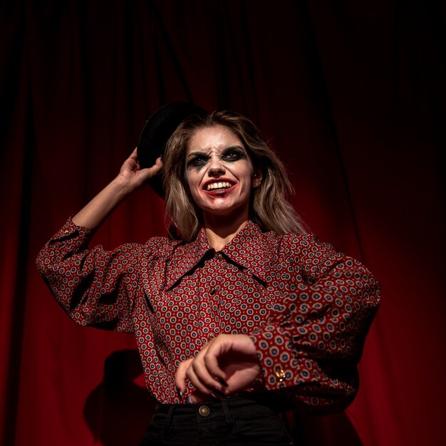 Low view shot of make-up woman clown