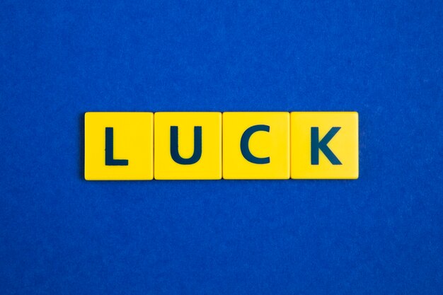 Luck word on yellow tiles