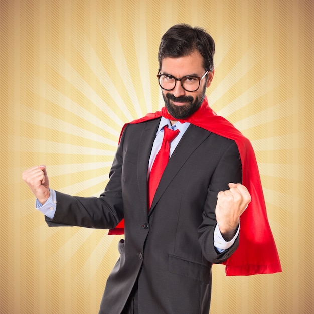 Free photo lucky businessman dressed like superhero