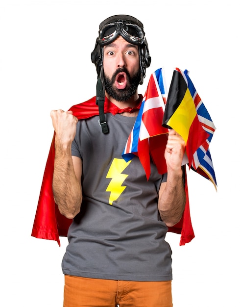 Free photo lucky superhero with a lot of flags