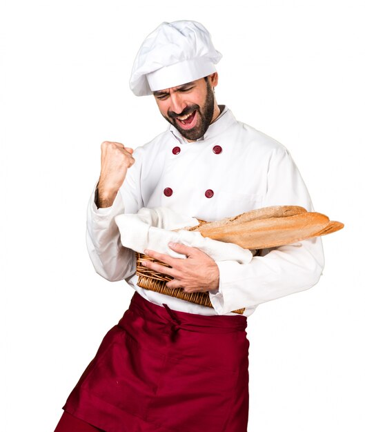 Lucky young baker holding some bread