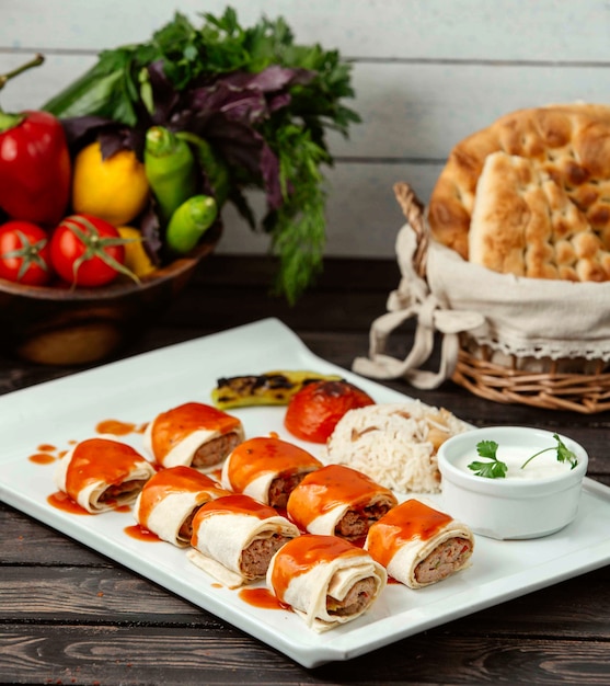 Lule kebab rolls with rice on the table