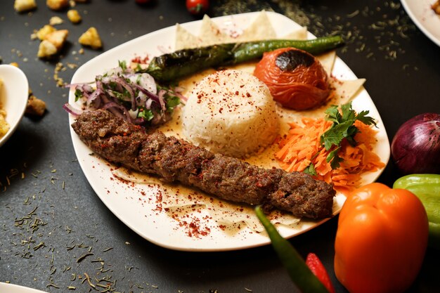 Lule kebab with rice and fried vegetables