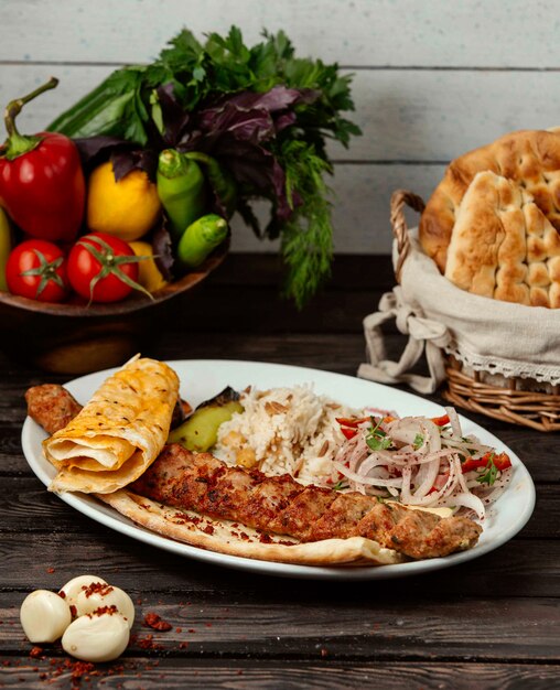 Lule kebab with vegetables on the table