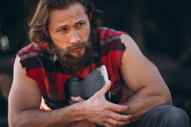 Free photo lumberjack in forest