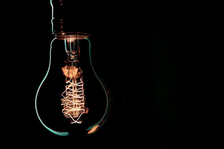 Free Photo luminous lamp hang in the dark. decor and atmosphere concept.