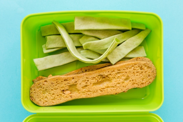 Lunchbox with bread and vegetable