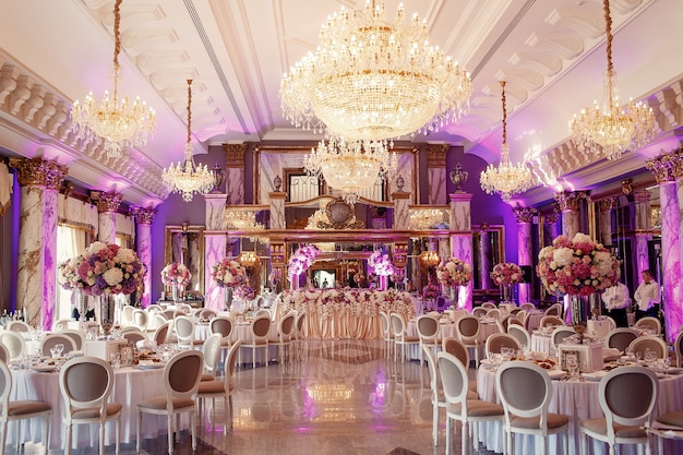 Luxurious dinner hall with large crystal chandelier