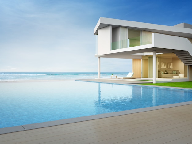 Роскошный пляжный дом с бассейном с видом на море и террасой в современном дизайне.