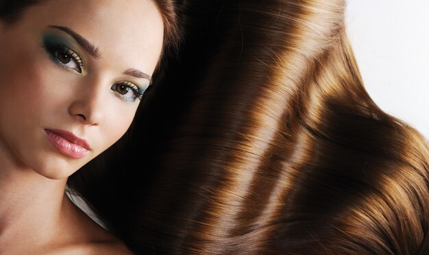 Luxury of beautiful brunette long healthy female hair
