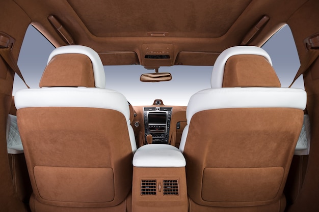 Luxury car interior in brown and white colors