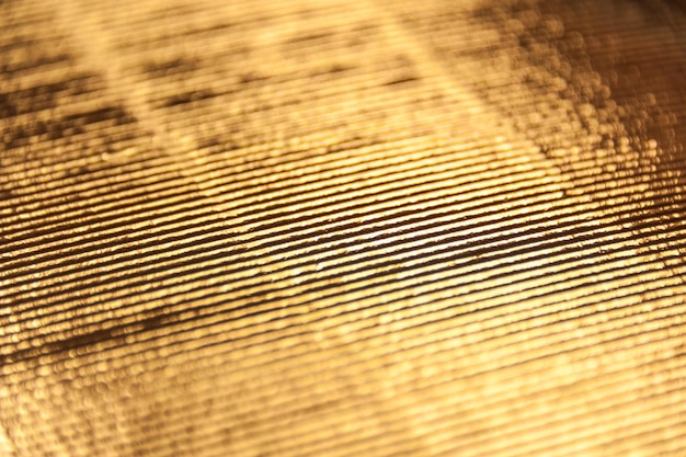 Luxury gold corrugated paper texture for background , abstract golden pattern. close up.