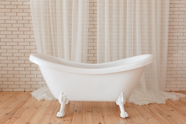 Free Photo luxury vintage bathtub on white brick background