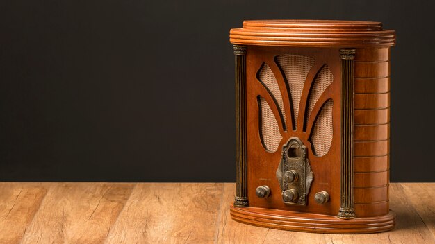 Luxury vintage radio on wooden board copy space