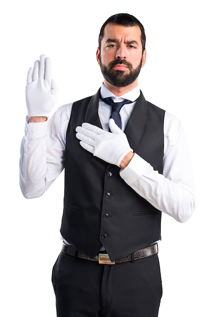 Luxury waiter doing oath