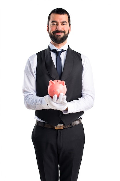 Free photo luxury waiter holding a piggybank