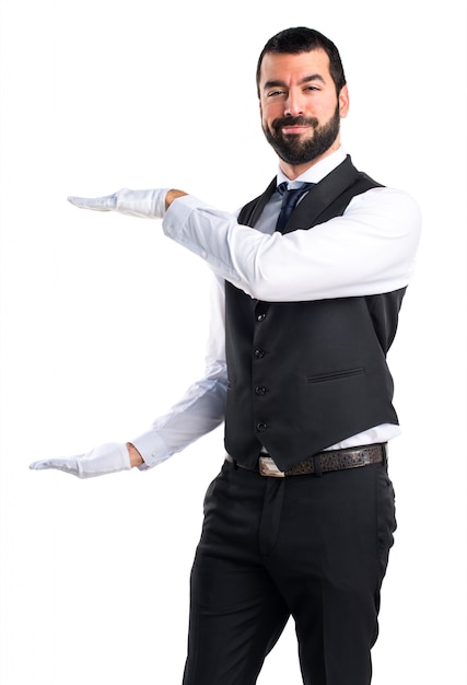 Luxury waiter holding something
