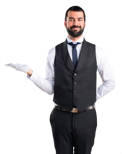 Luxury waiter holding something