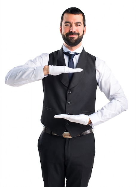 Luxury waiter holding something