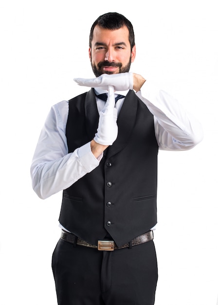 Luxury waiter making time out gesture