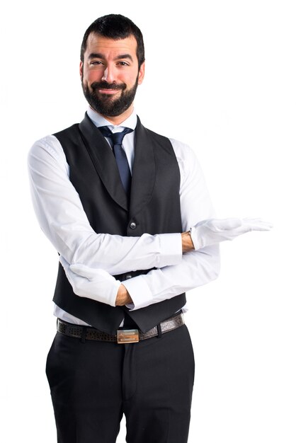 Luxury waiter presenting something