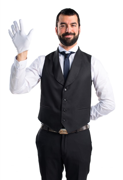 Luxury waiter saluting