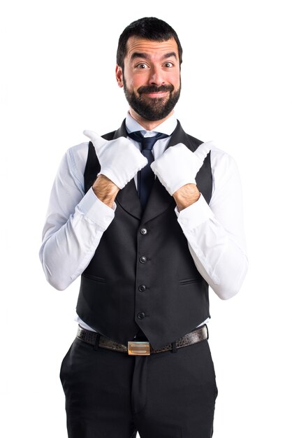 Luxury waiter with thumb up