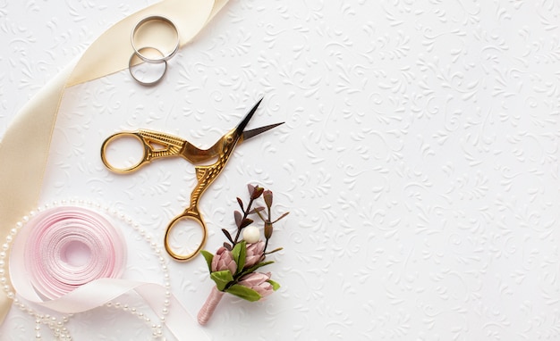 Free photo luxury wedding concept with scissors and ribbon