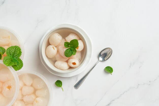 Lychee in Syrup on white surface