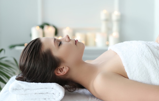 Lying woman prepared to receive a beauty treatment