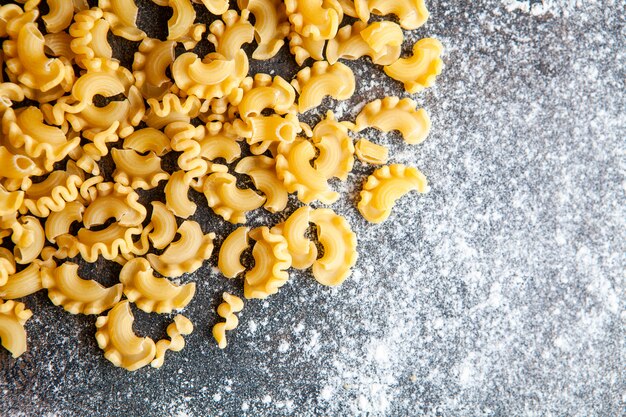 Macaroni on a dark textured background. top view. horizontal