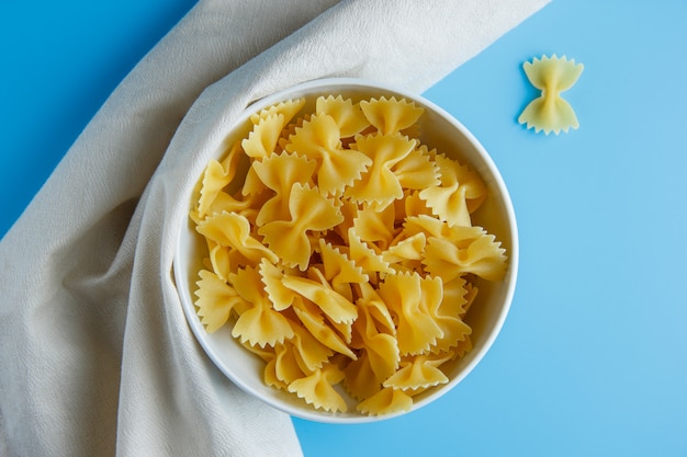 Macaroni pasta in a bowl on a cloth