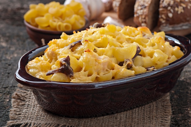 Macaroni with cheese, chicken and mushrooms baked in the oven