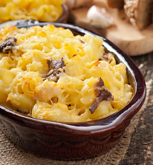 Macaroni with cheese, chicken and mushrooms baked in the oven