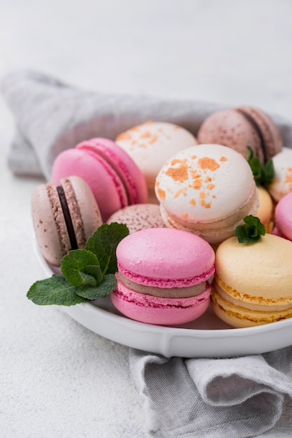 Macarons with mint on bowl
